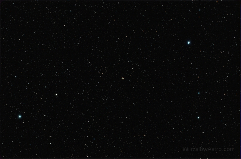 m57_5minx9_070525.jpg -    Object:   M57 - Ring Nebula     Date:   May 25th 2007     Instrument:   SV4 Apo     Camera:   QHY-8     Exposure:   9x 5 minutes     Filters:   IDAS LPS     Comments:   A fun shot whilst the Moon was up and through passing high cloud. I was surpised to see two stars resolved in the centre of M57 in this wide field unsharpened shot.  